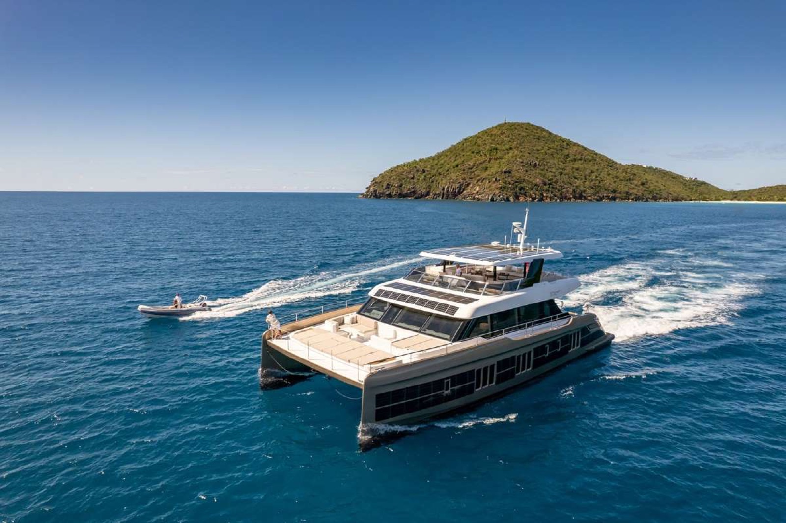 SOL, power catamaran, cruising at sea